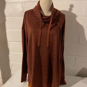 Rust color sweater with side slits